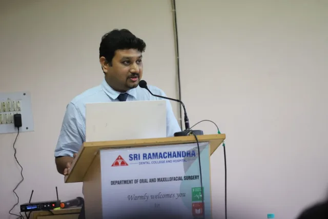 Dr. Pradeep S. delivering the invited faculty lecture on landmark papers in oral cancer at ROME 2026, Sri Ramachandra Dental College, Chennai